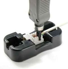 Keystone tool for installing keystone jacks in wall plates and panels.